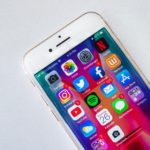 phone with social media icons
